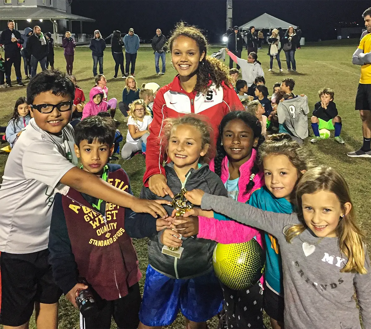 Kids holding trophy